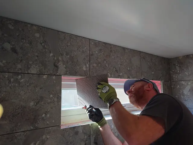 Fitting the last tile beside the window